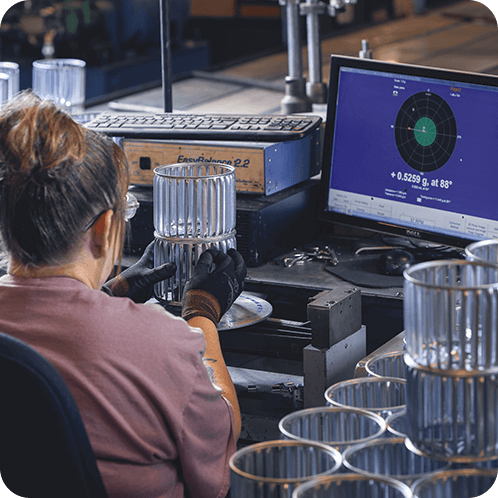 An employee on the computer checking the product